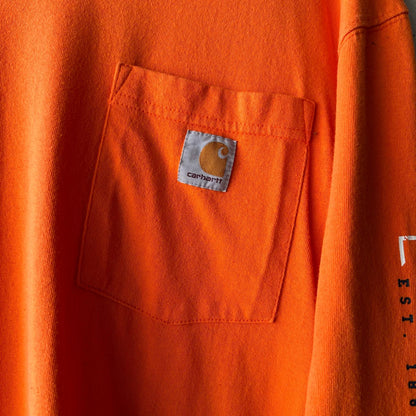 (L) Reme Carhartt Pocket Manga Larga Naranja "Property Of Carhartt"